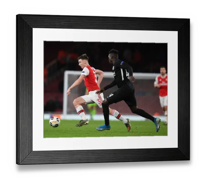 Framed Print : Arsenal's Kieran Tierney Outmaneuvers Eintracht Frankfurt's Danny Da Costa in UEFA Europa League Clash Framed Print : Arsenal's Kieran Tierney Outmaneuvers Eintracht Frankfurt's Danny Da Costa in UEFA Europa League Clash