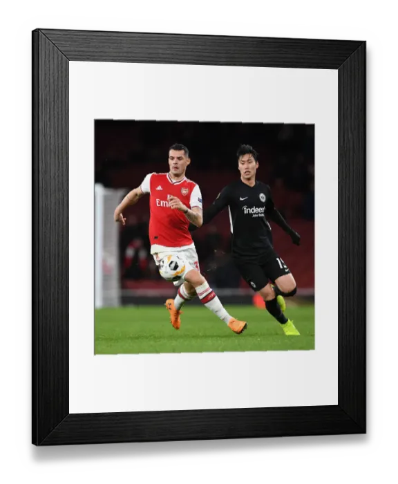 Framed Print : Arsenal's Xhaka Overpowers Eintracht Frankfurt in Europa League Clash Framed Print : Arsenal's Xhaka Overpowers Eintracht Frankfurt in Europa League Clash