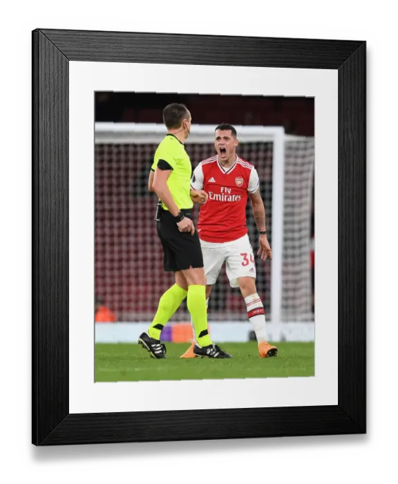 Framed Print : Arsenal's Xhaka Booked in Europa League Match Against Eintracht Frankfurt