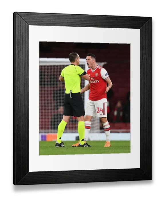 Framed Print : Arsenal's Xhaka Booked in Europa League Clash Against Eintracht Frankfurt