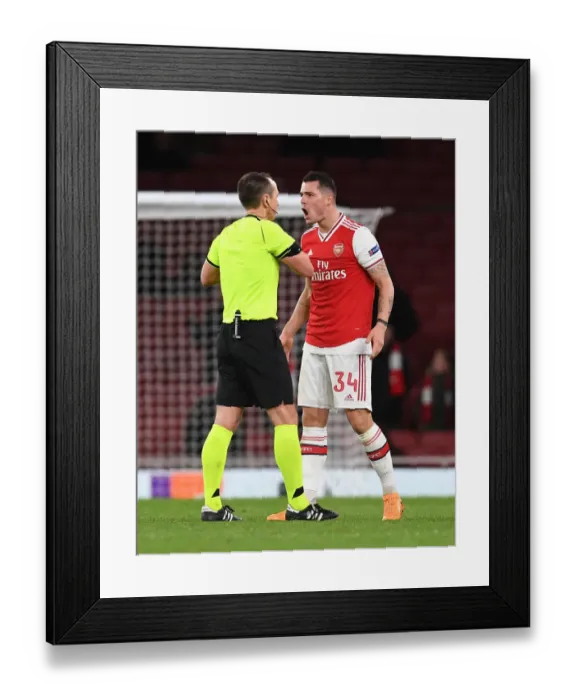 Framed Print : Arsenal's Xhaka Booked in Europa League Clash Against Eintracht Frankfurt