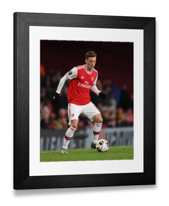 Framed Print : Arsenal's Ozil Shines in Europa League Victory over Eintracht Frankfurt