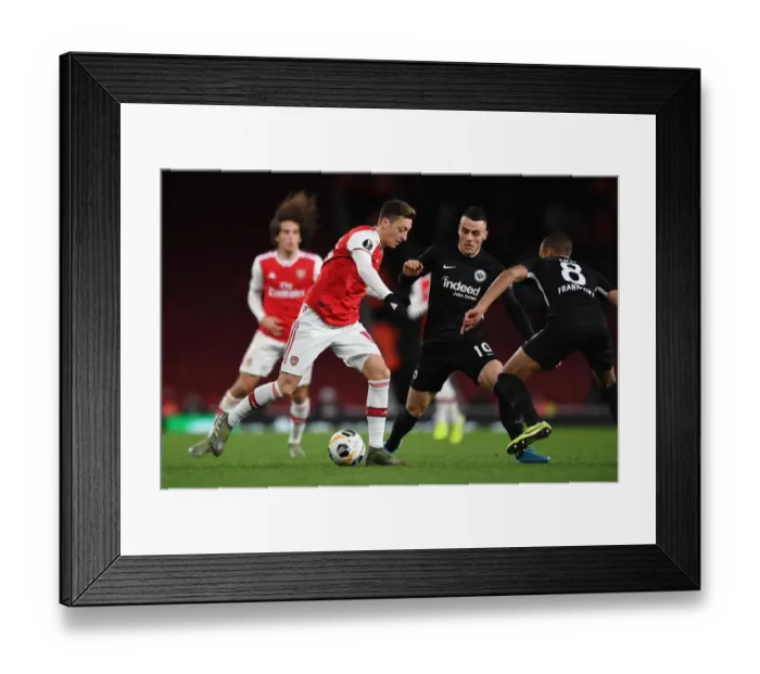 Framed Print : Arsenal vs Eintracht Frankfurt: Mesut Ozil Clashes with Filip Kostic in Europa League Showdown