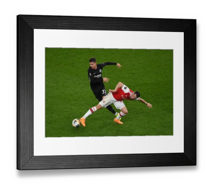 Framed Print : Arsenal vs Eintracht Frankfurt: Granit Xhaka Clashes with Andre Silva in Europa League Showdown
