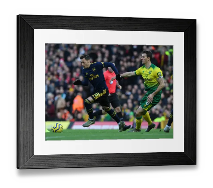 Framed Print : Mesut Ozil vs. Christoph Zimmermann: Battle at Carrow Road - Norwich City vs. Arsenal FC, Premier League 2019-20
