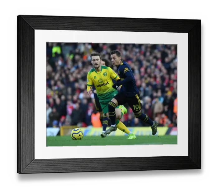 Framed Print : Mesut Ozil vs. Tom Trybull: Battle in the Premier League - Norwich City vs. Arsenal FC (December 2019)