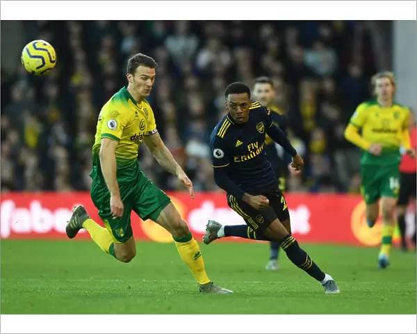 Joe Willock vs. Christoph Zimmermann: Intense Battle at Carrow Road - Norwich City vs. Arsenal FC, Premier League 2019-20