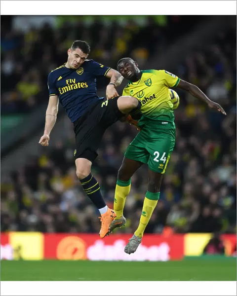 Granit Xhaka vs Ibrahim Amadou: Intense Battle for Ball Possession - Norwich City vs Arsenal FC, Premier League 2019-20
