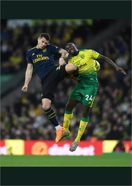 Granit Xhaka vs Ibrahim Amadou: Intense Battle for Ball Possession - Norwich City vs Arsenal FC, Premier League 2019-20