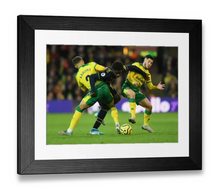 Framed Print : Clash at Carrow Road: Saka Faces Off Against Norwich Duo Framed Print : Clash at Carrow Road: Saka Faces Off Against Norwich Duo