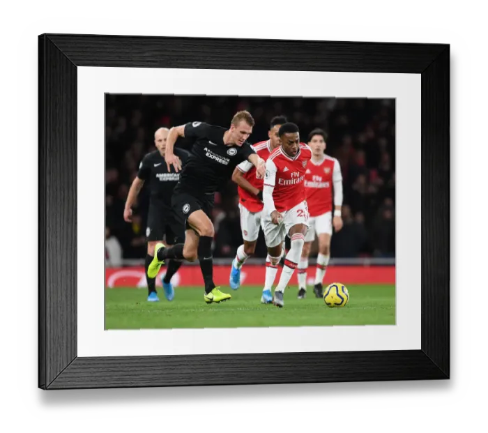 Framed Print : Arsenal's Joe Willock Outwits Dan Burn: A Premier League Tactical Battle at Emirates Stadium