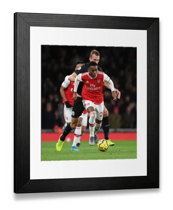 Framed Print : Arsenal's Joe Willock Outsmarts Dan Burn: A Premier League Tactical Battle