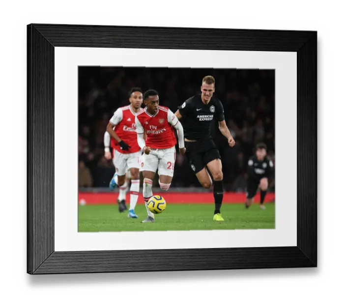 Framed Print : Arsenal's Joe Willock Outwits Dan Burn: A Premier League Tactical Duel