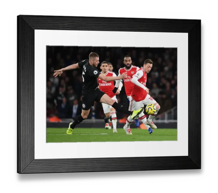 Framed Print : Arsenal vs Brighton: Mesut Ozil Clashes with Adam Webster in Premier League Showdown