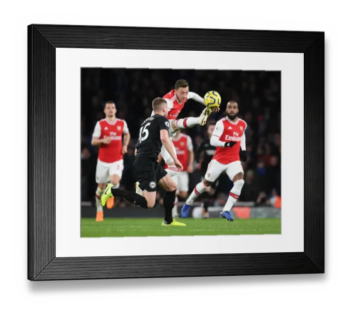 Framed Print : Arsenal vs Brighton: Mesut Ozil Faces Off Against Adam Webster in Premier League Clash Framed Print : Arsenal vs Brighton: Mesut Ozil Faces Off Against Adam Webster in Premier League Clash