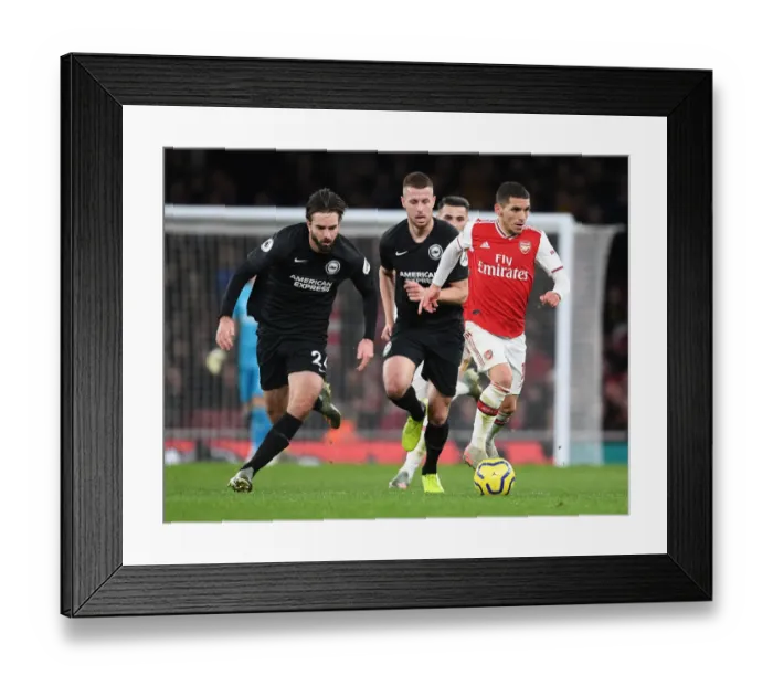 Framed Print : Torreira's Agile Run: Outshining Brighton Defenders at Emirates Stadium