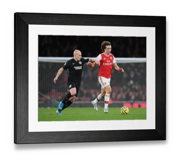 Framed Print : Arsenal's David Luiz Outmaneuvers Brighton's Aaron Mooy in Premier League Clash Framed Print : Arsenal's David Luiz Outmaneuvers Brighton's Aaron Mooy in Premier League Clash