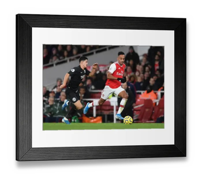Framed Print : Arsenal's Aubameyang Clashes with Brighton's Alzate in Premier League Showdown
