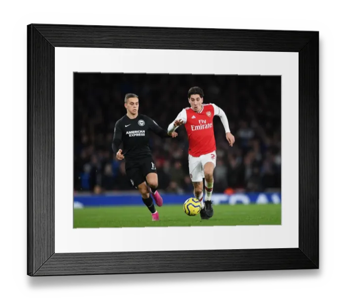 Framed Print : Bellerin vs Trossard: A Premier League Showdown at Emirates Stadium