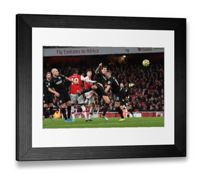 Framed Print : Arsenal's Martinelli Battles Past Brighton's Dunk in Premier League Clash Framed Print : Arsenal's Martinelli Battles Past Brighton's Dunk in Premier League Clash