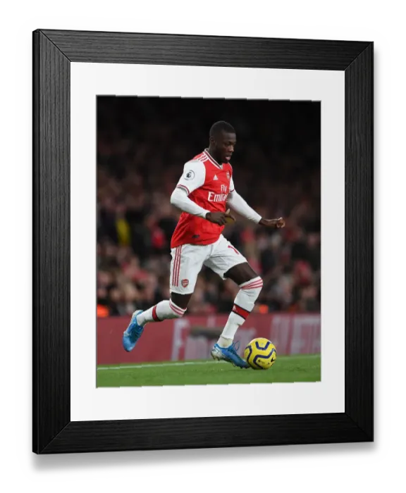 Framed Print : Arsenal's Nicolas Pepe in Action: Premier League 2019-20 - Arsenal vs Brighton & Hove Albion Framed Print : Arsenal's Nicolas Pepe in Action: Premier League 2019-20 - Arsenal vs Brighton & Hove Albion