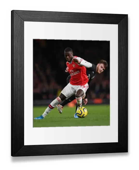 Framed Print : Arsenal vs Brighton: Pepe vs Connelly Clash in Premier League Showdown Framed Print : Arsenal vs Brighton: Pepe vs Connelly Clash in Premier League Showdown