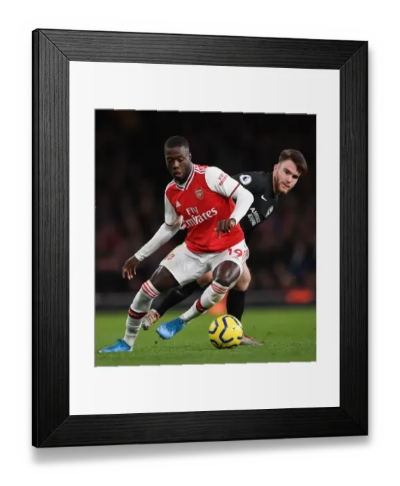 Framed Print : Arsenal vs Brighton: Pepe vs Connolly Clash in Premier League Showdown
