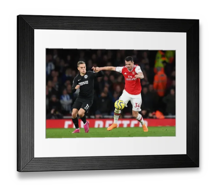 Framed Print : Arsenal vs Brighton: Xhaka vs Trossard Clash in Premier League Showdown