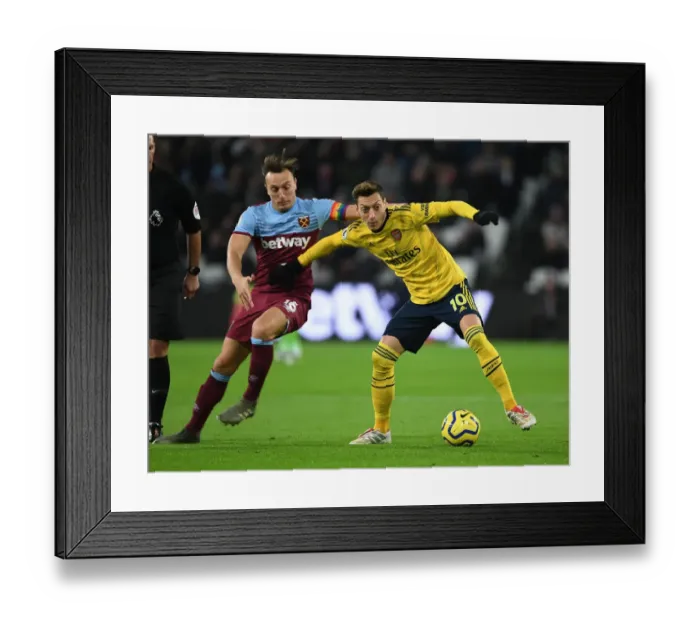 Framed Print : Mesut Ozil vs Mark Noble: Intense Battle at London Stadium - West Ham United vs Arsenal FC, Premier League 2019-20 Framed Print : Mesut Ozil vs Mark Noble: Intense Battle at London Stadium - West Ham United vs Arsenal FC, Premier League 2019-20
