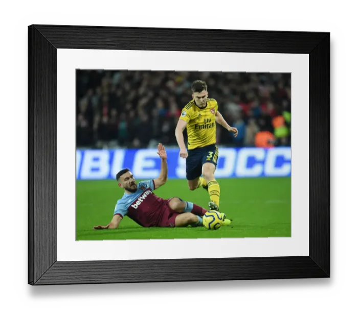 Framed Print : Arsenal's Kieran Tierney Outwits West Ham's Snodgrass: Premier League Battle Framed Print : Arsenal's Kieran Tierney Outwits West Ham's Snodgrass: Premier League Battle