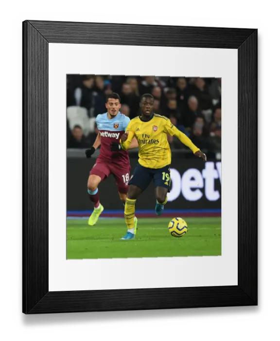 Framed Print : Nicolas Pepe Breaks Past Fornals: West Ham vs Arsenal, Premier League 2019-20 Framed Print : Nicolas Pepe Breaks Past Fornals: West Ham vs Arsenal, Premier League 2019-20