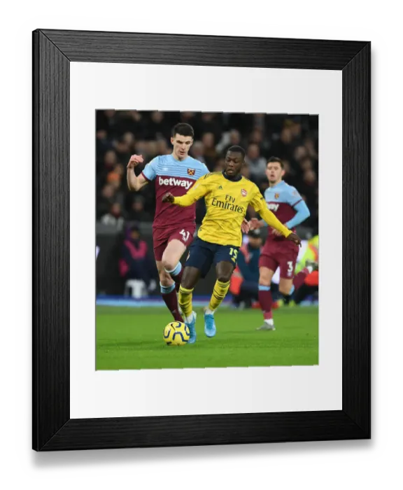 Framed Print : Nicolas Pepe Outmaneuvers Declan Rice: West Ham United vs. Arsenal FC, Premier League 2019-20