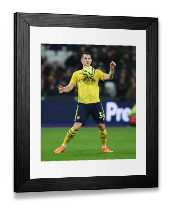 Framed Print : Granit Xhaka in Action: West Ham United vs. Arsenal FC, Premier League 2019-20 Framed Print : Granit Xhaka in Action: West Ham United vs. Arsenal FC, Premier League 2019-20
