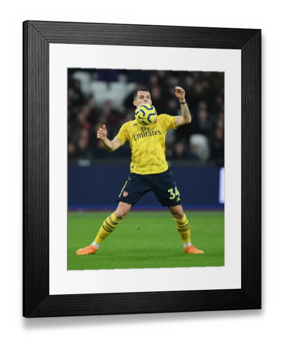 Framed Print : Granit Xhaka: Arsenal Midfielder in Action Against West Ham United, Premier League 2019-20 Framed Print : Granit Xhaka: Arsenal Midfielder in Action Against West Ham United, Premier League 2019-20