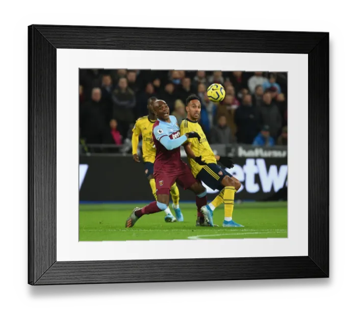 Framed Print : Aubameyang vs Ogbonna: Intense Battle at London Stadium - West Ham United vs Arsenal FC, Premier League 2019-20