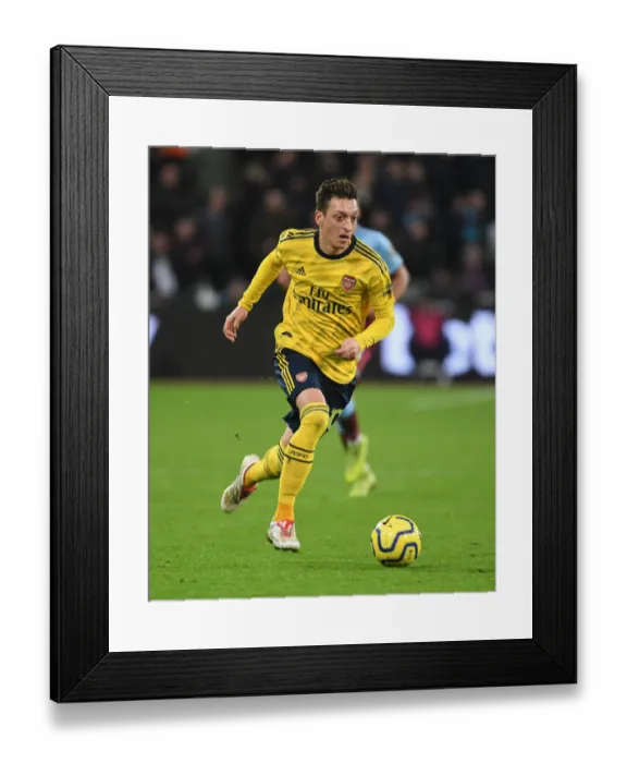 Framed Print : Mesut Ozil in Action: West Ham United vs. Arsenal FC, Premier League 2019-20 Framed Print : Mesut Ozil in Action: West Ham United vs. Arsenal FC, Premier League 2019-20