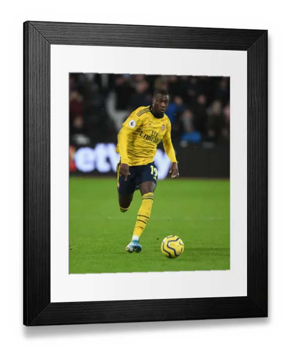 Framed Print : Pepe in Action: West Ham vs. Arsenal Premier League Clash Framed Print : Pepe in Action: West Ham vs. Arsenal Premier League Clash