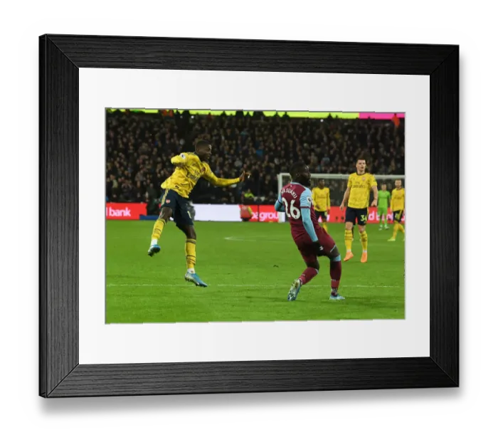 Framed Print : Nicolas Pepe Scores Arsenal's Second Goal in Premier League Clash Against West Ham United