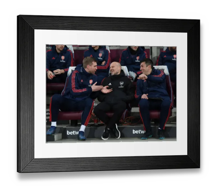 Framed Print : Arsenal Coaches Ljungberg, Mertesacker, and Bibbo Share a Lighthearted Moment on the Sidelines during Arsenal's Match against West Ham Framed Print : Arsenal Coaches Ljungberg, Mertesacker, and Bibbo Share a Lighthearted Moment on the Sidelines during Arsenal's Match against West Ham