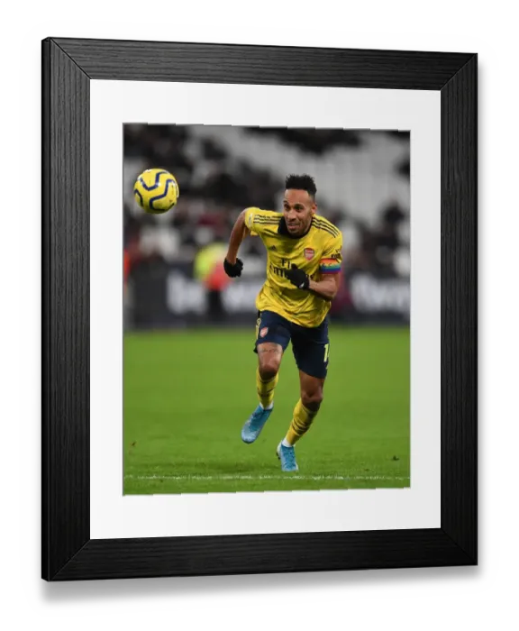 Framed Print : Arsenal's Aubameyang Scores Dramatic Winner Against West Ham United in Premier League Clash Framed Print : Arsenal's Aubameyang Scores Dramatic Winner Against West Ham United in Premier League Clash