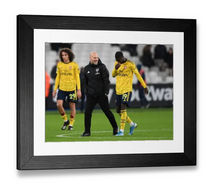 Framed Print : Arsenal's Freddie Ljungberg Consoles Nicolas Pepe after West Ham Clash
