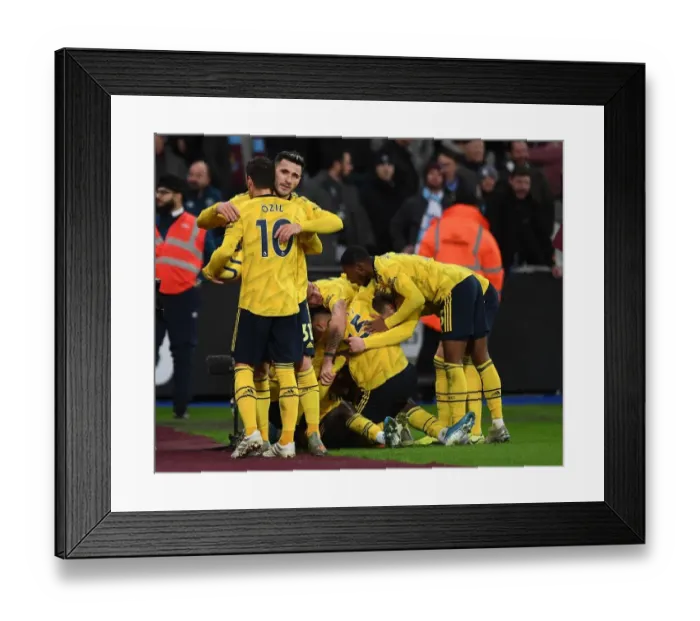 Framed Print : Arsenal Celebrate Second Goal Against West Ham United in Premier League Clash Framed Print : Arsenal Celebrate Second Goal Against West Ham United in Premier League Clash