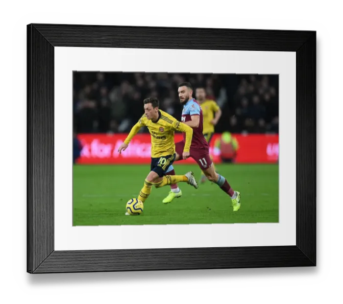 Framed Print : Mesut Ozil Under Pressure: West Ham vs. Arsenal, Premier League 2019-20: A Battle at London Stadium Framed Print : Mesut Ozil Under Pressure: West Ham vs. Arsenal, Premier League 2019-20: A Battle at London Stadium