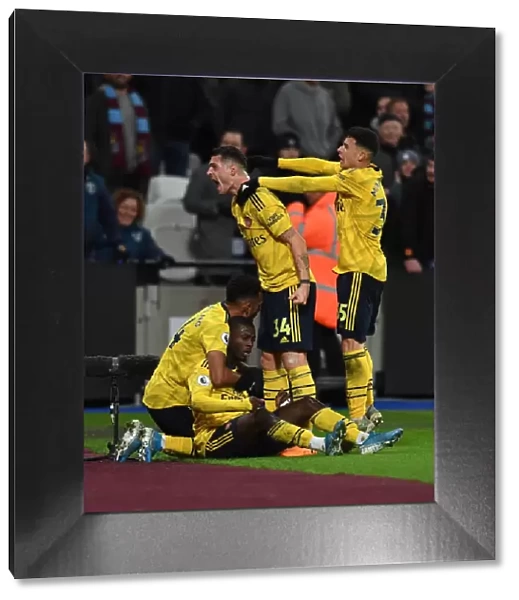 Arsenal's Nicolas Pepe and Teammates Celebrate Goal Against West Ham United, Premier League 2019-20