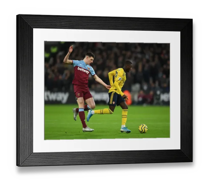 Framed Print : Pepe vs Rice: A Premier League Battle - Arsenal's Nicolas Pepe Takes on West Ham's Declan Rice (December 2019)