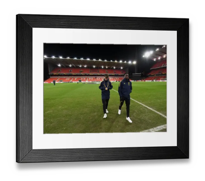Framed Print : Arsenal Players Explore Standard Liege's Pitch Ahead of UEFA Europa League Clash