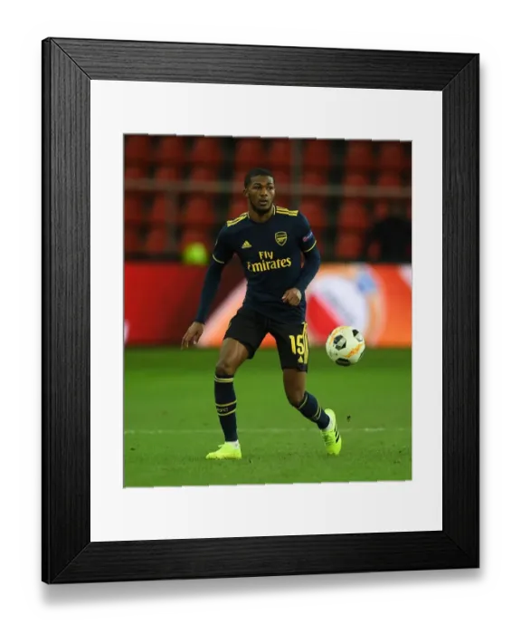 Framed Print : Arsenal's Ainsley Maitland-Niles in Action against Standard Liege in UEFA Europa League Group F