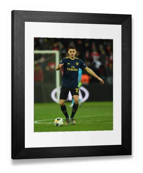 Framed Print : Arsenal's Mavropanos in Action against Standard Liege in UEFA Europa League (December 2019)