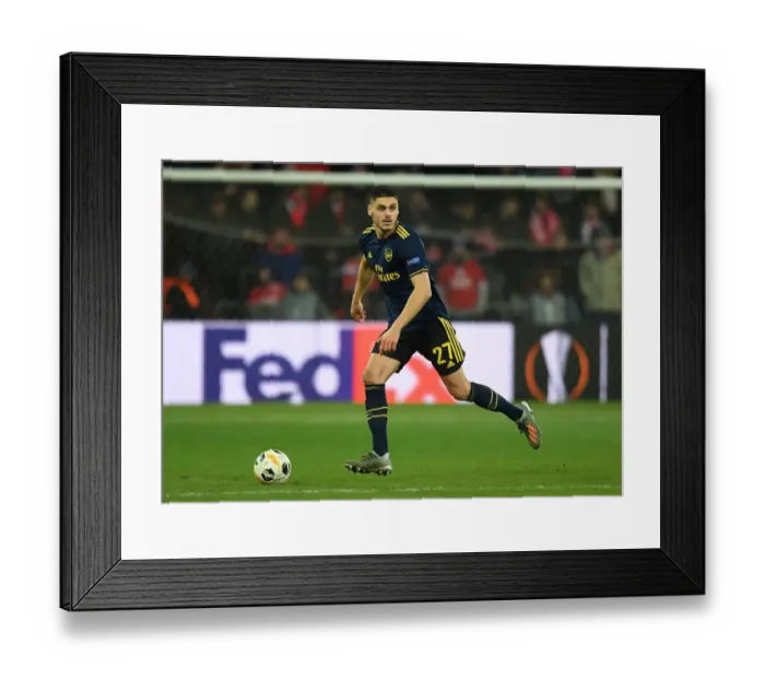 Framed Print : Arsenal's Mavropanos in Action against Standard Liege in Europa League Group Stage (December 2019)