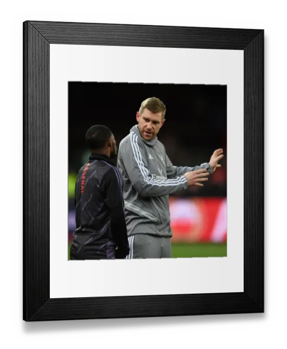 Framed Print : Arsenal's Mertesacker Coaches Maitland-Niles Before Standard Liege Clash (UEFA Europa League, Group F) Framed Print : Arsenal's Mertesacker Coaches Maitland-Niles Before Standard Liege Clash (UEFA Europa League, Group F)